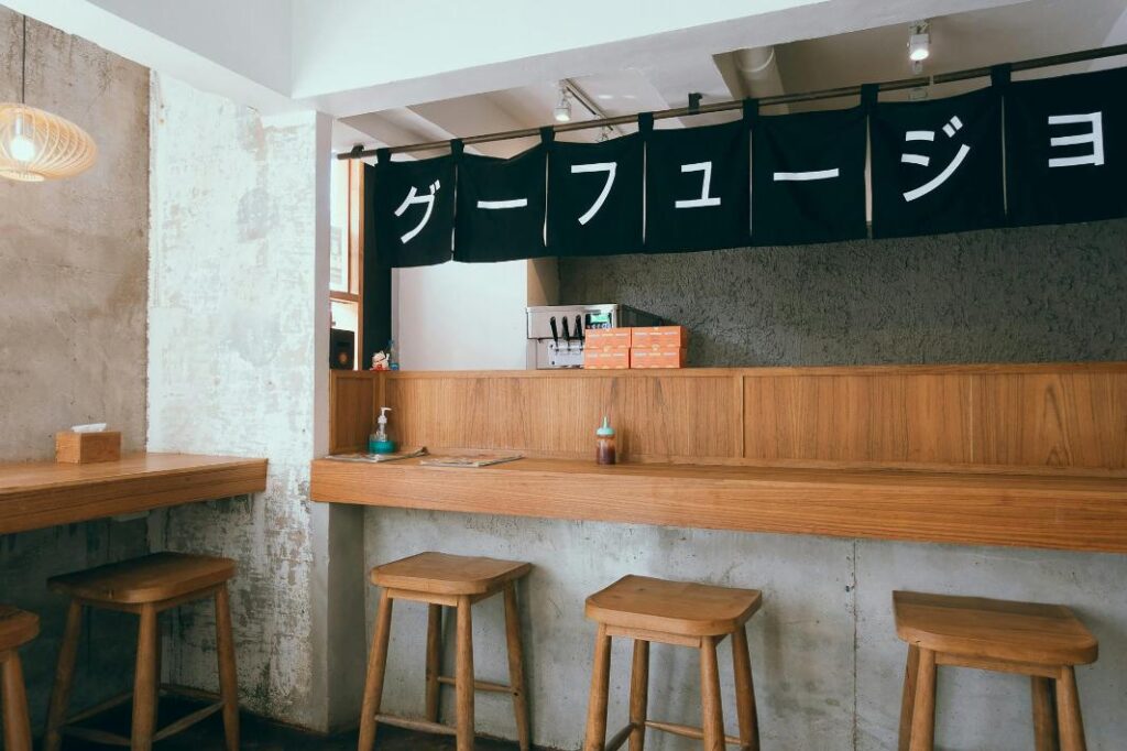A clean and modern take on the traditional Japanese Izakaya design scheme what invites people to come and dine.