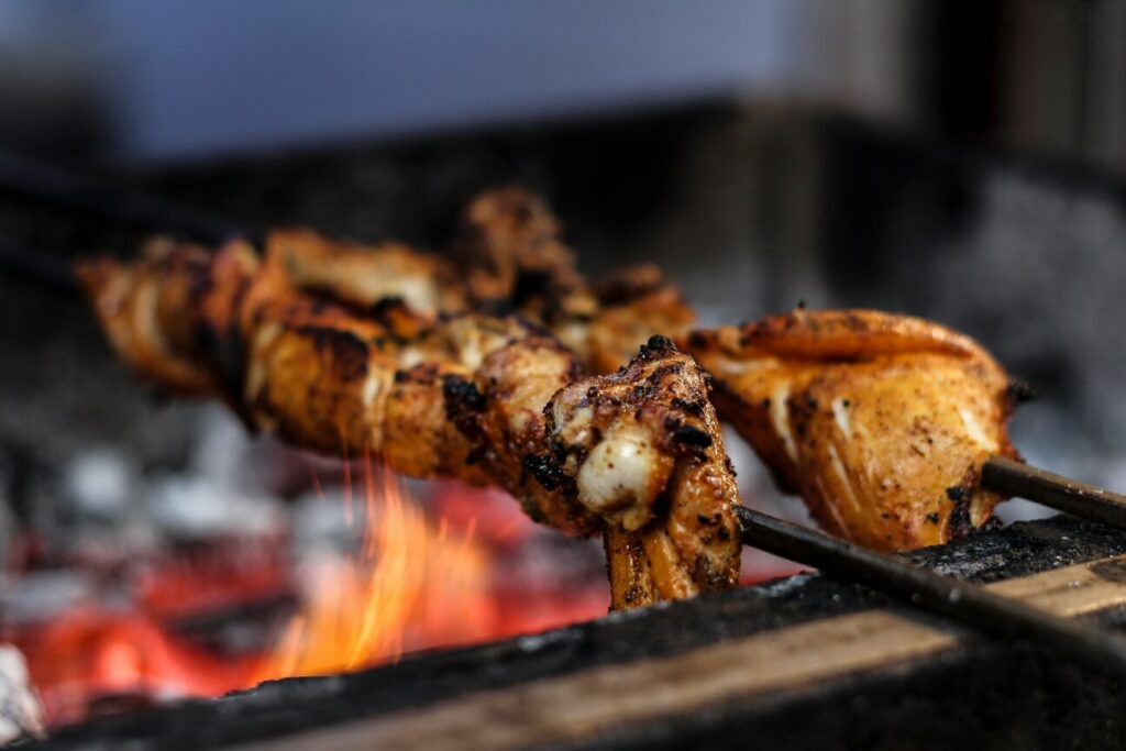 Close-up of perfectly grilled yakitori skewers, showcasing juicy, tender chicken pieces glazed with savory sauce, served on traditional wooden sticks