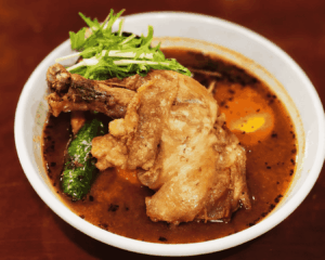 Different styles of Sapporo soup curry served with various toppings such as vegetables, chicken, and seafood.