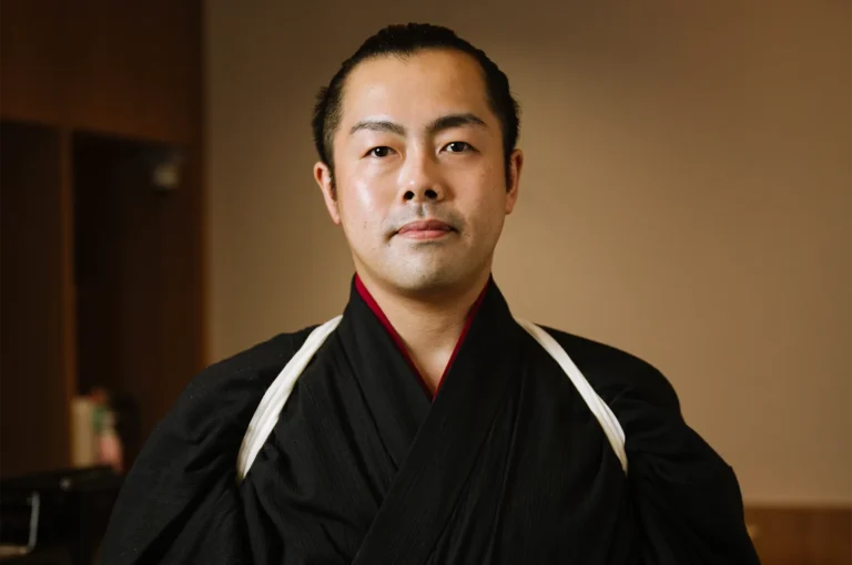 Portrait of Chef Masa dressed in traditional Japanese attire.